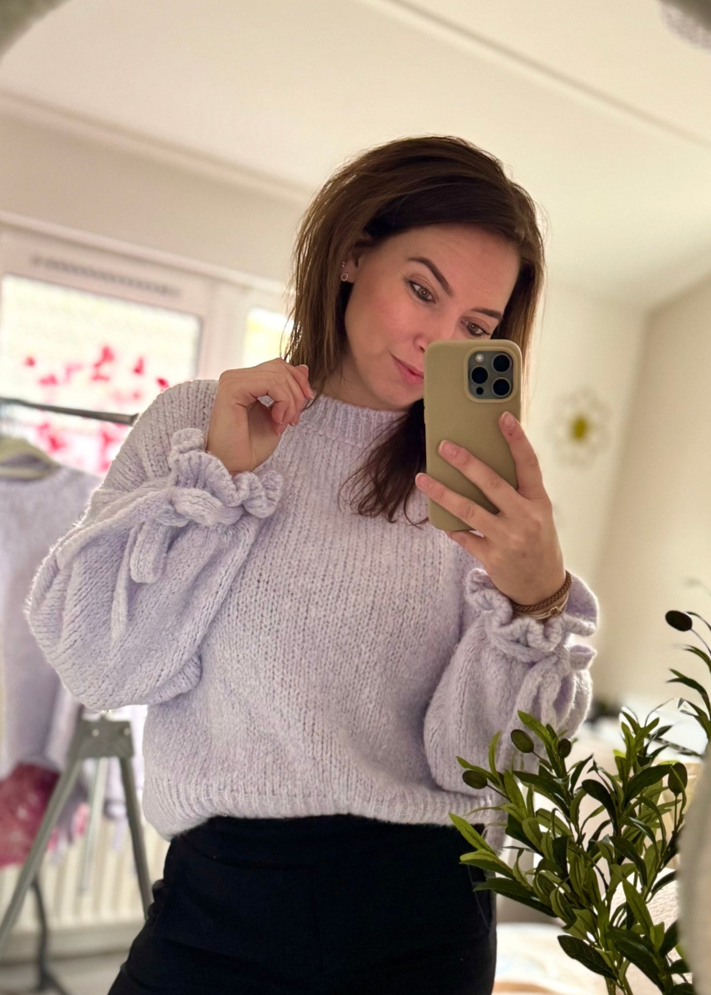 Sweater lila met strikjes